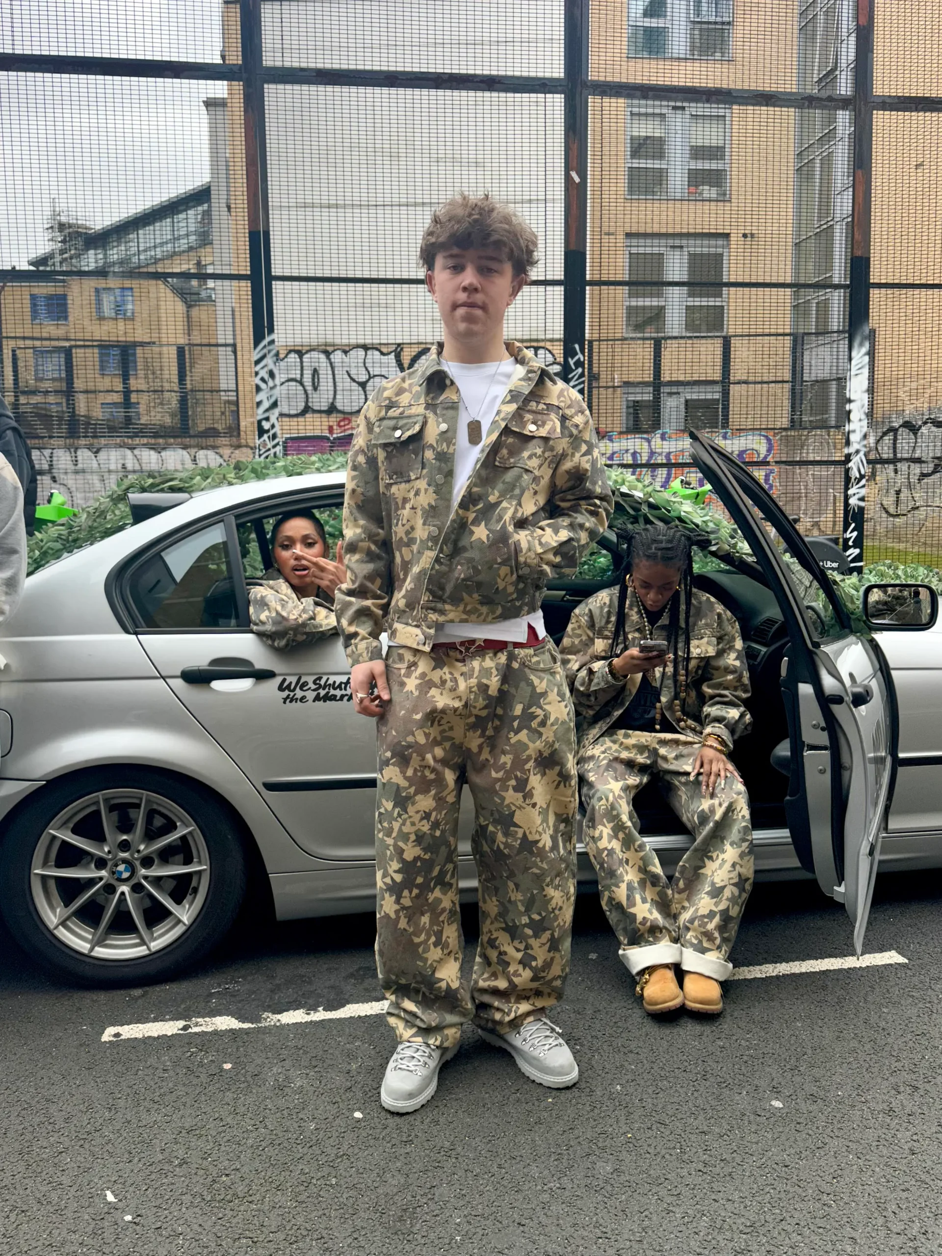 Young creatives in matching streetwear expressing shared identity and culture in an urban London setting.