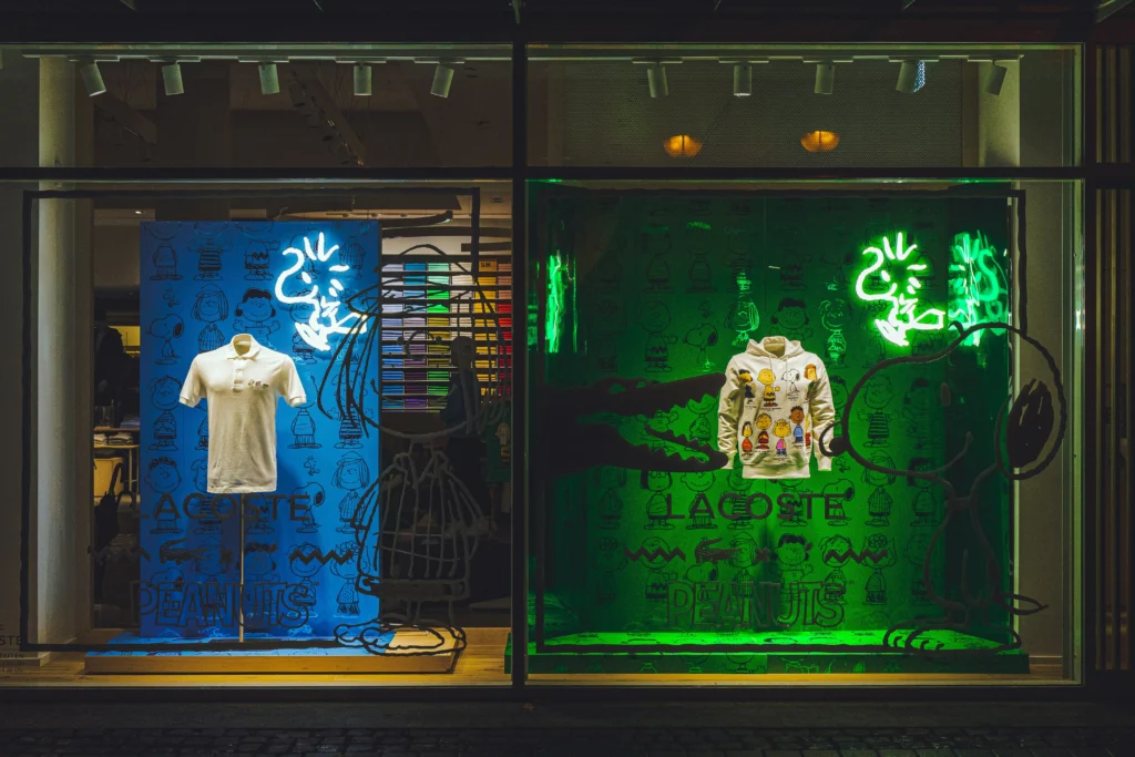 Quantitative vs Qualitative Market Research, Or Both? Lacoste x Peanuts fashion collaboration displayed in a colourful illustrated retail window.